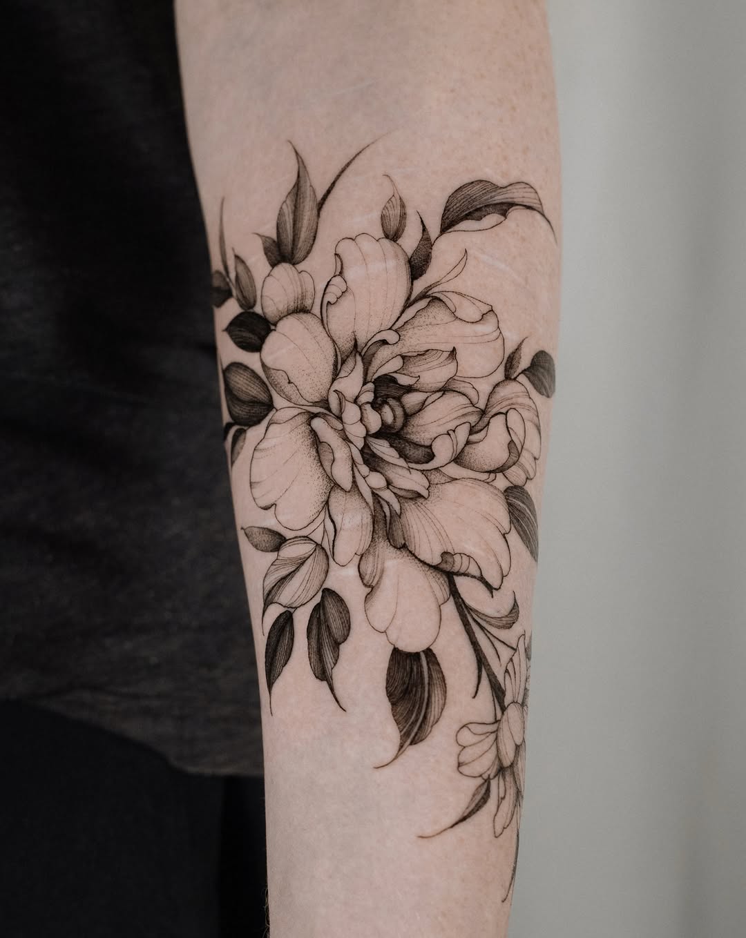 Delicate black-line floral cluster with subtle shading.