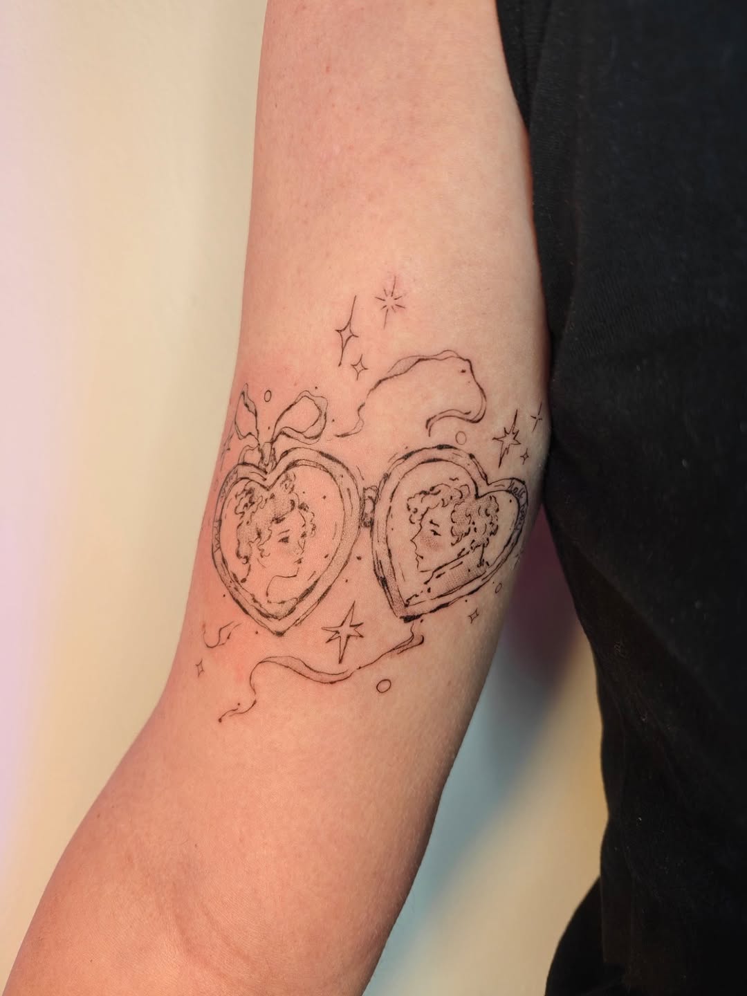 Romantic double-heart linework with vintage-profile portraits