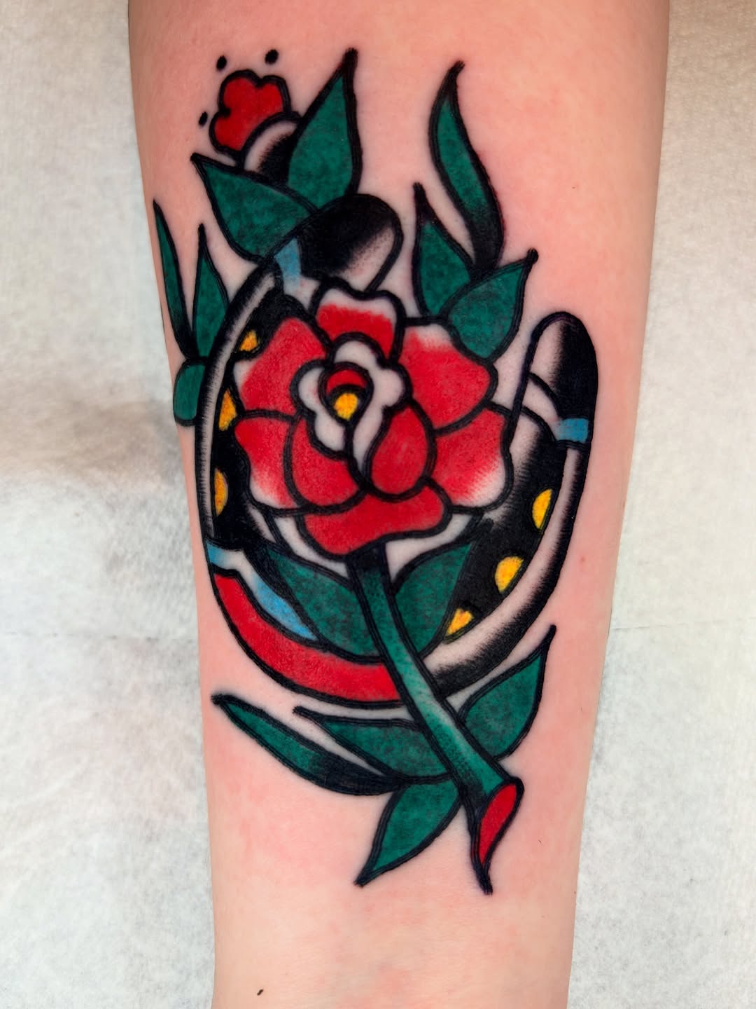 Bold traditional rose with vivid colors and leaves