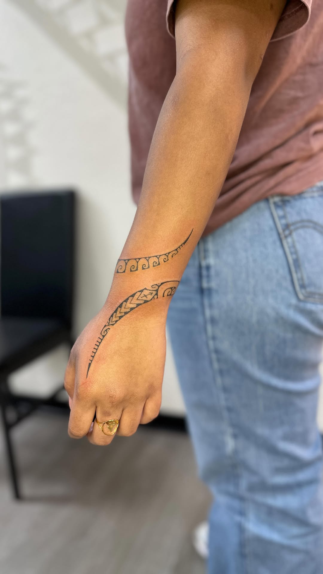 Polynesian-inspired wristbands with delicate geometric patterns