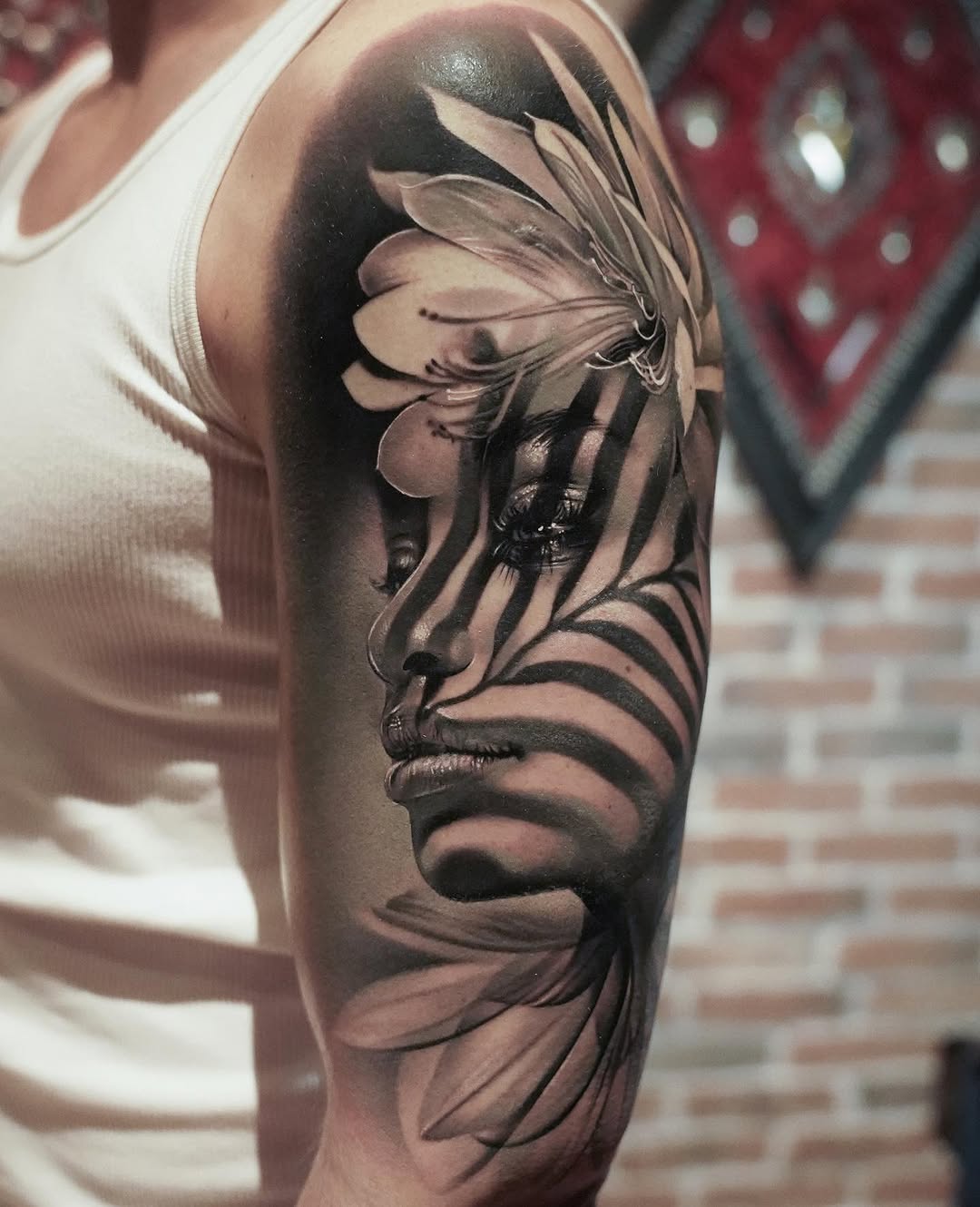 Striking grayscale portrait with zebra-stripe overlay and petals.