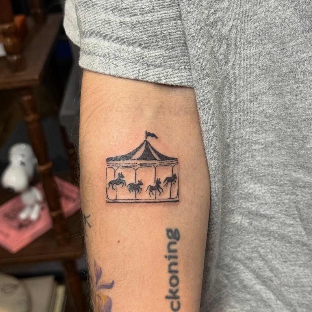 Whimsical line-work carousel within a tiny framed panel