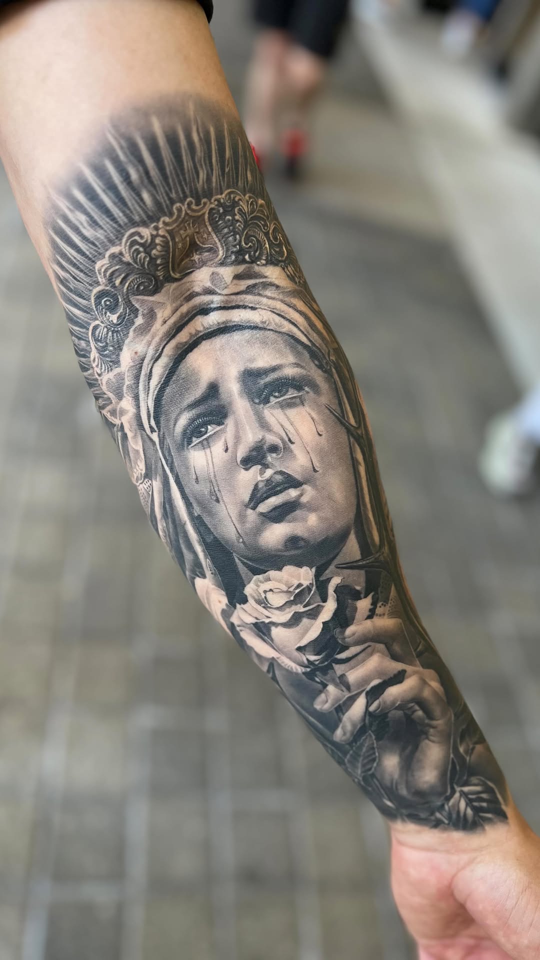 Hyper-detailed grayscale Our Lady of Sorrows portrait with tears.