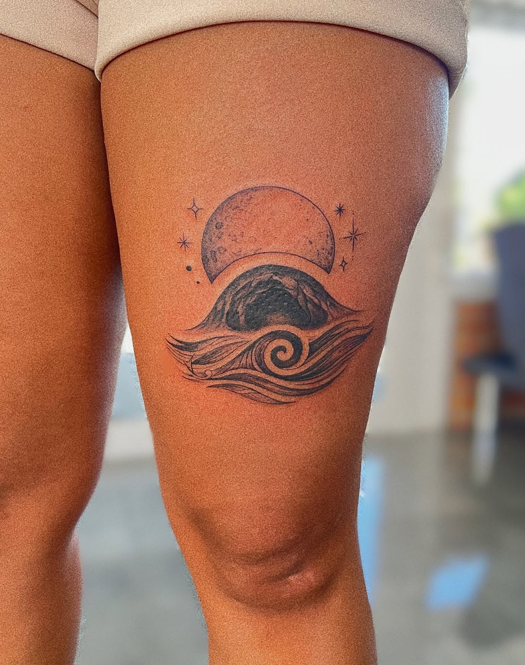 Moonlit cratered moon above stylized waves and mountain