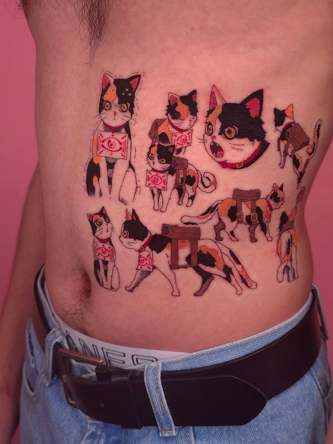 Playful calico cats marching in red sigil bands