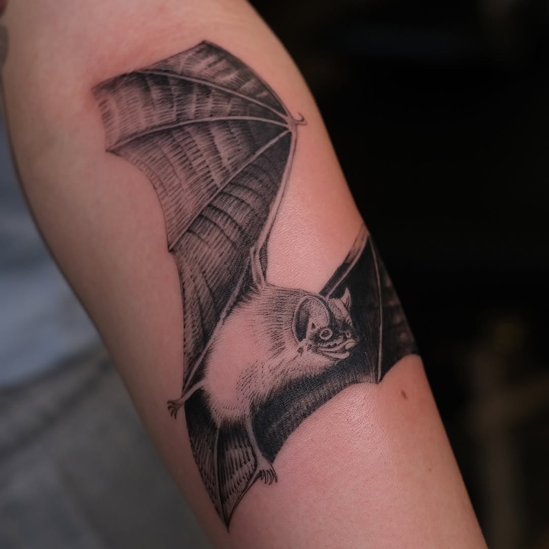Intricately shaded bat in etched blackwork style.