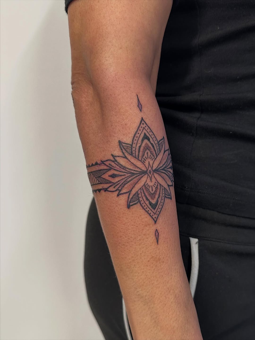 Intricate lotus mandala with geometric armband wrap