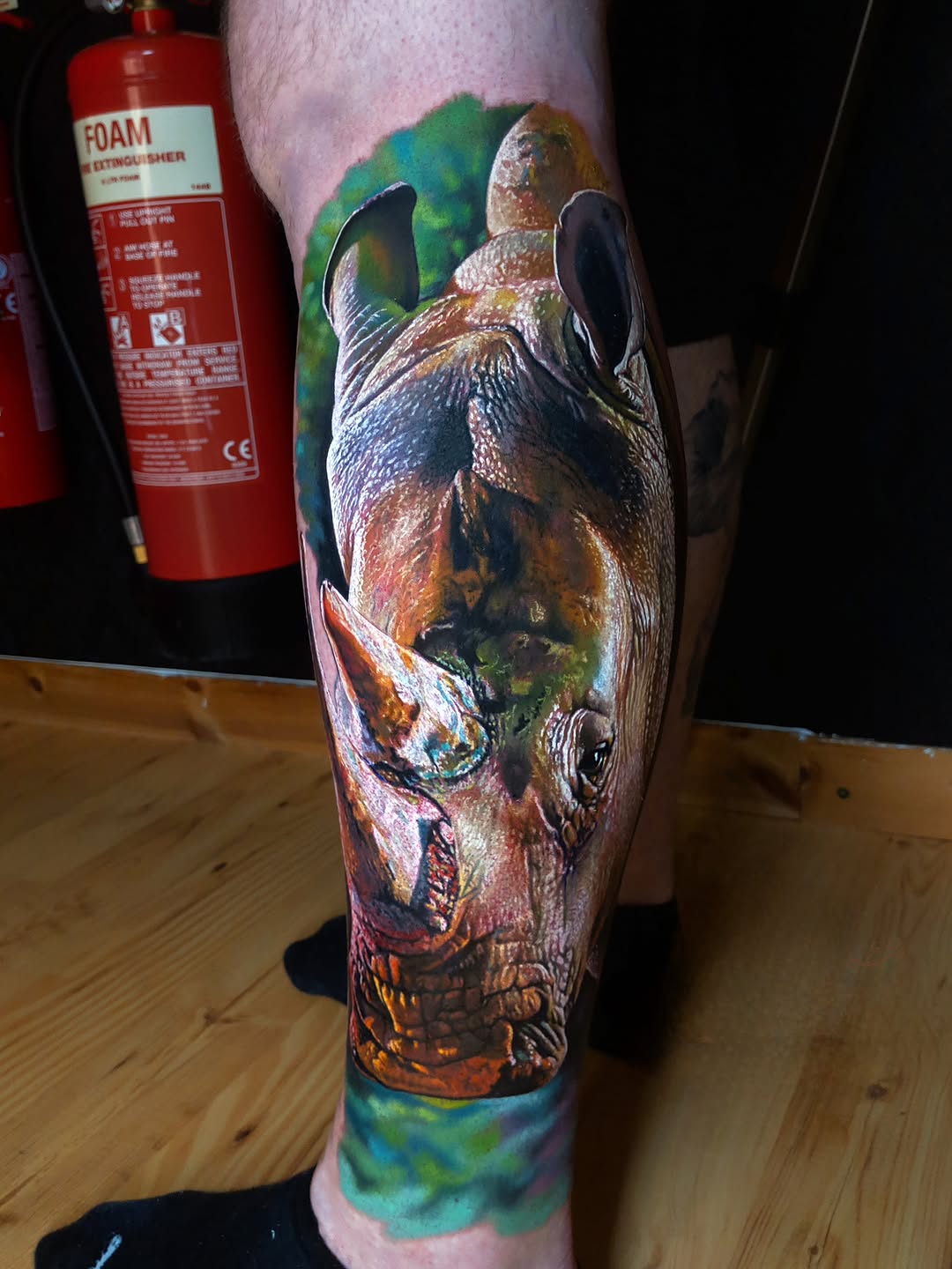 Vivid rhinoceros portrait in watercolor realism.