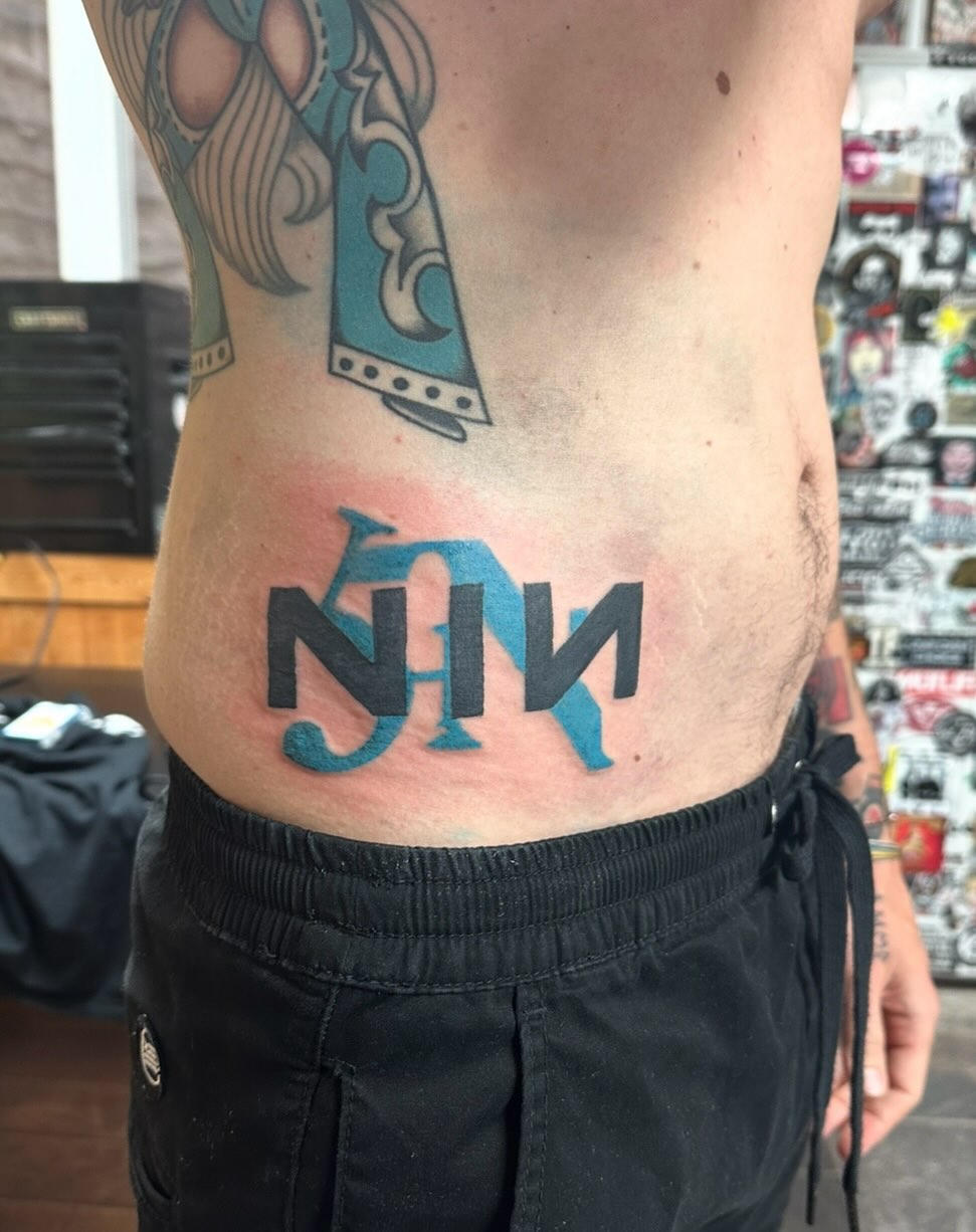 Bold black lettering over a blue geometric backdrop