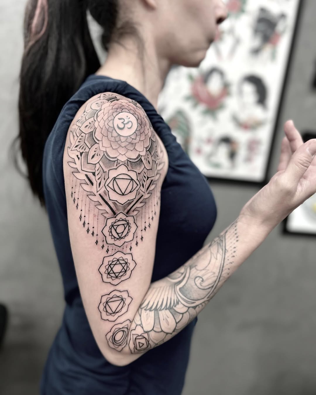 Intricate geometric mandala sleeve with bold linework.