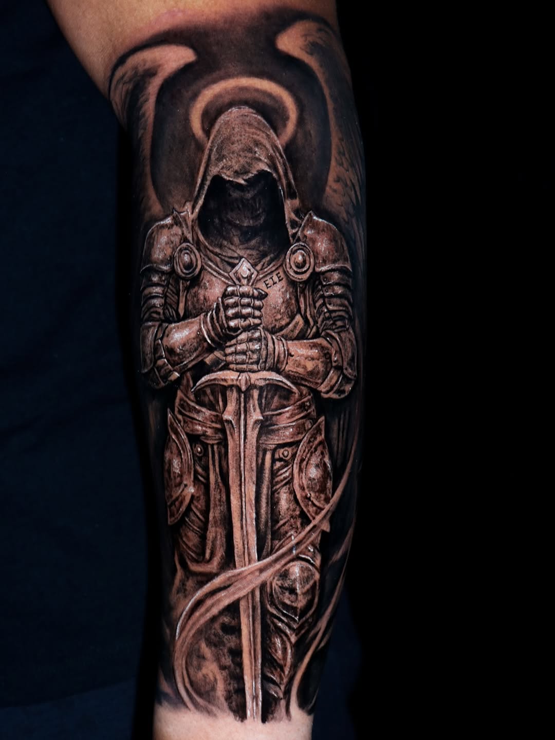 Dark grayscale armored knight with gleaming sword