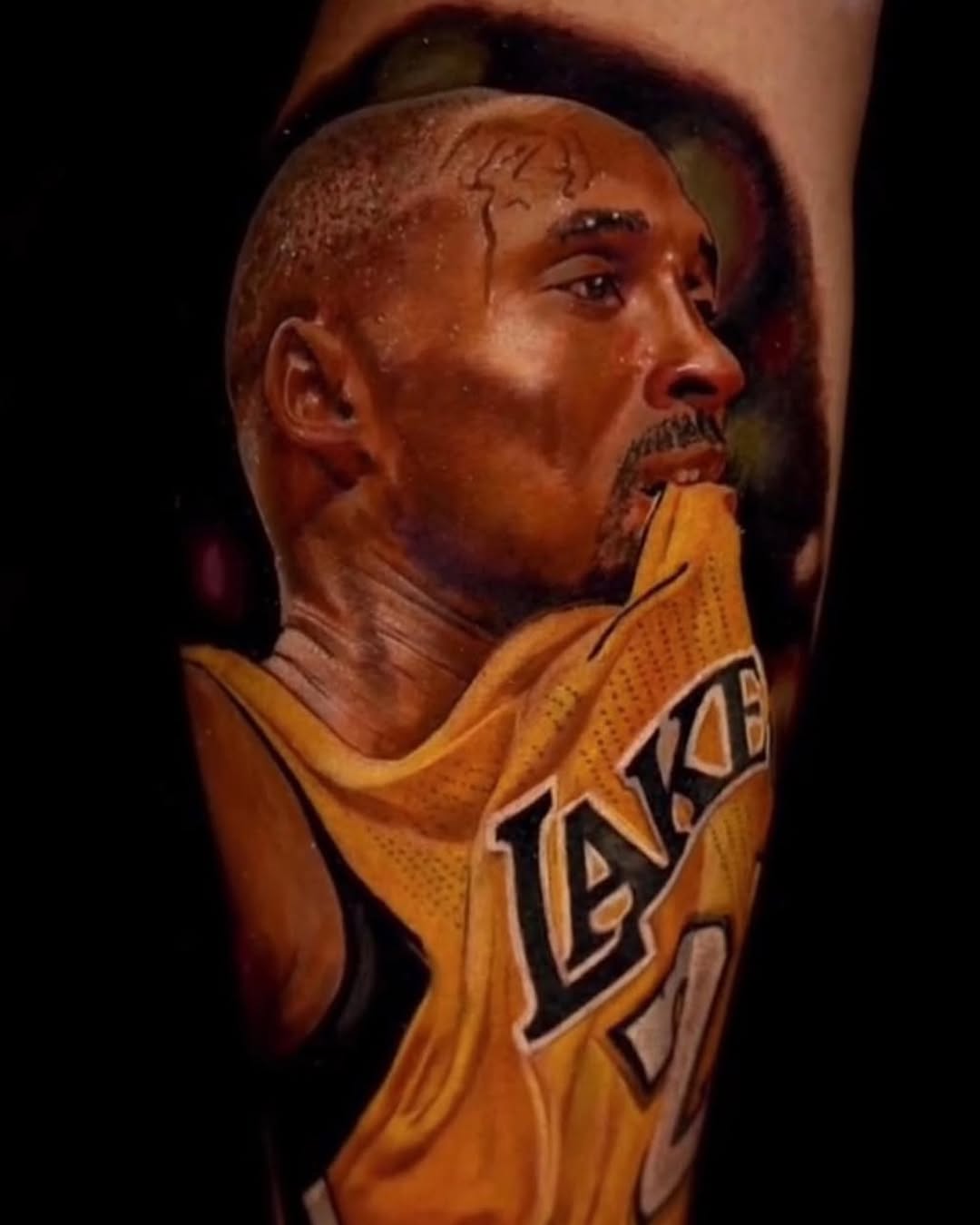 Bold snake tattoo wrapping shaved scalp with dramatic shading