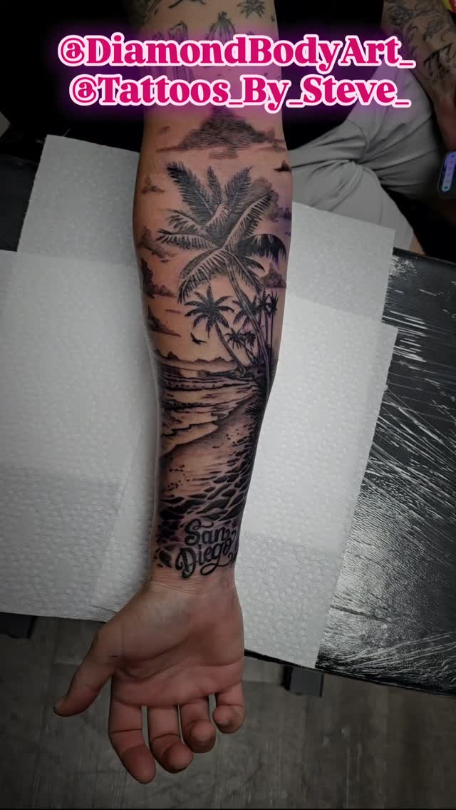 Dramatic black-and-gray beachscape with palm trees and birds