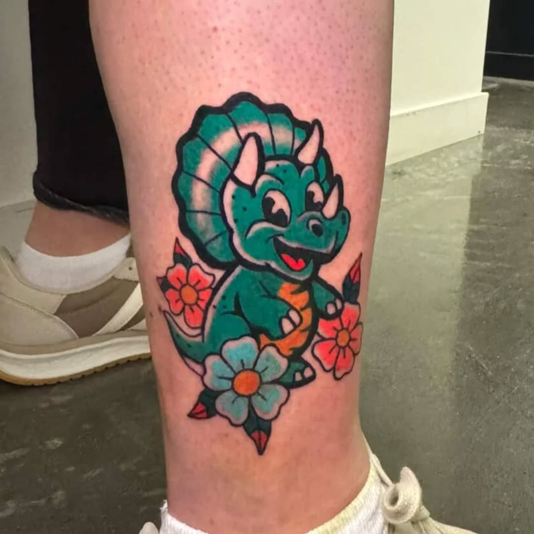 Playful cartoon triceratops amid bright blossoms.