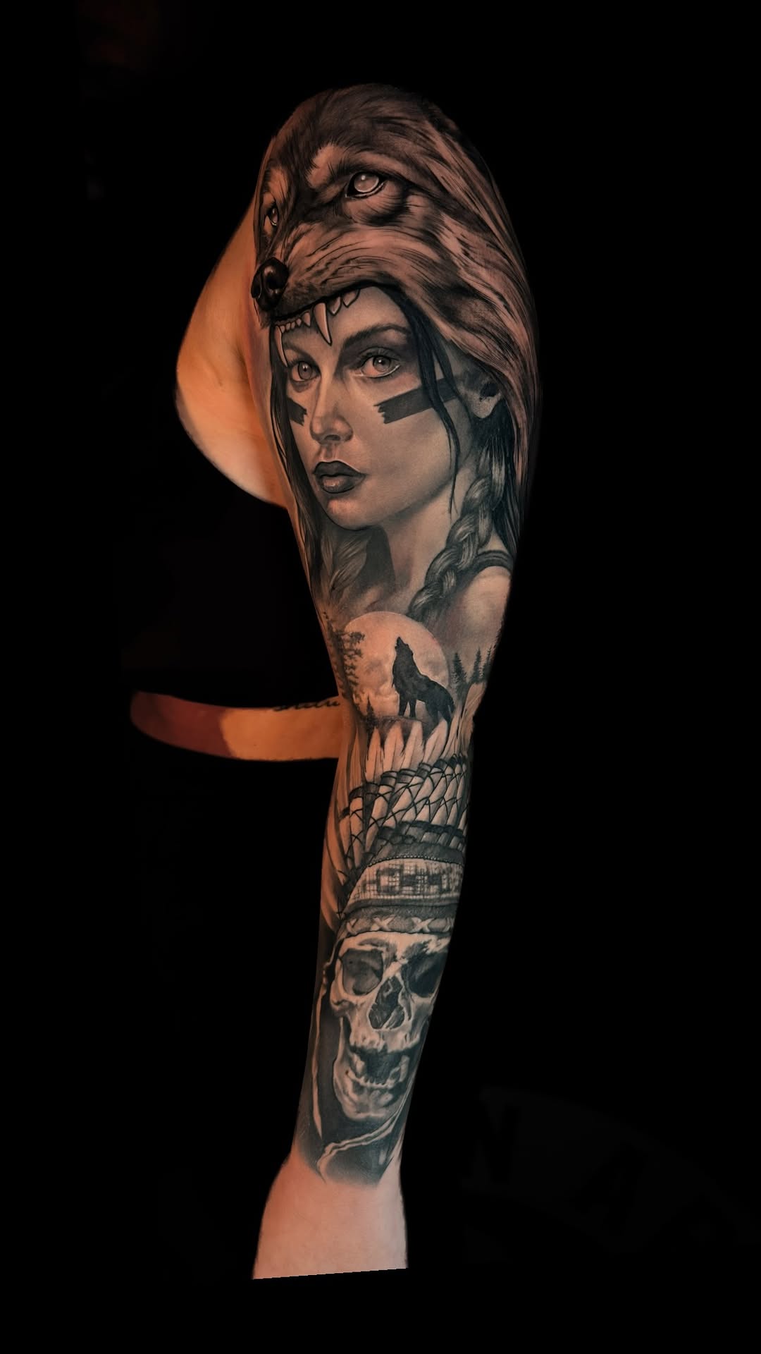 Monochrome wolf headdress frames a female portrait sleeve