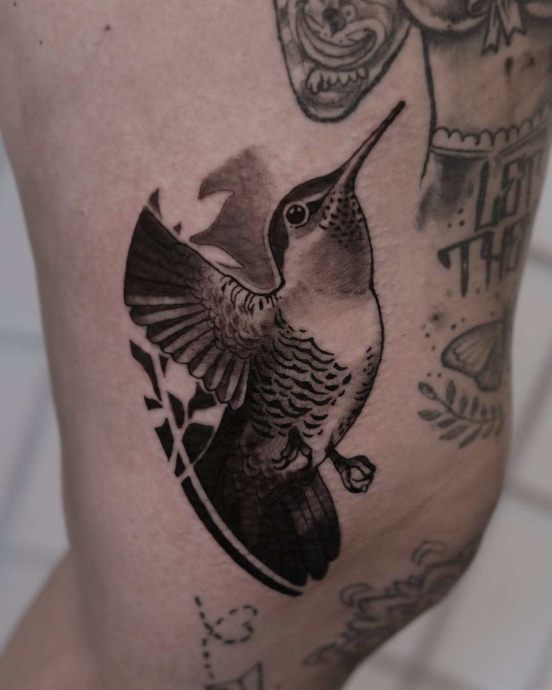 Bold hummingbird in blackwork with crisp linework