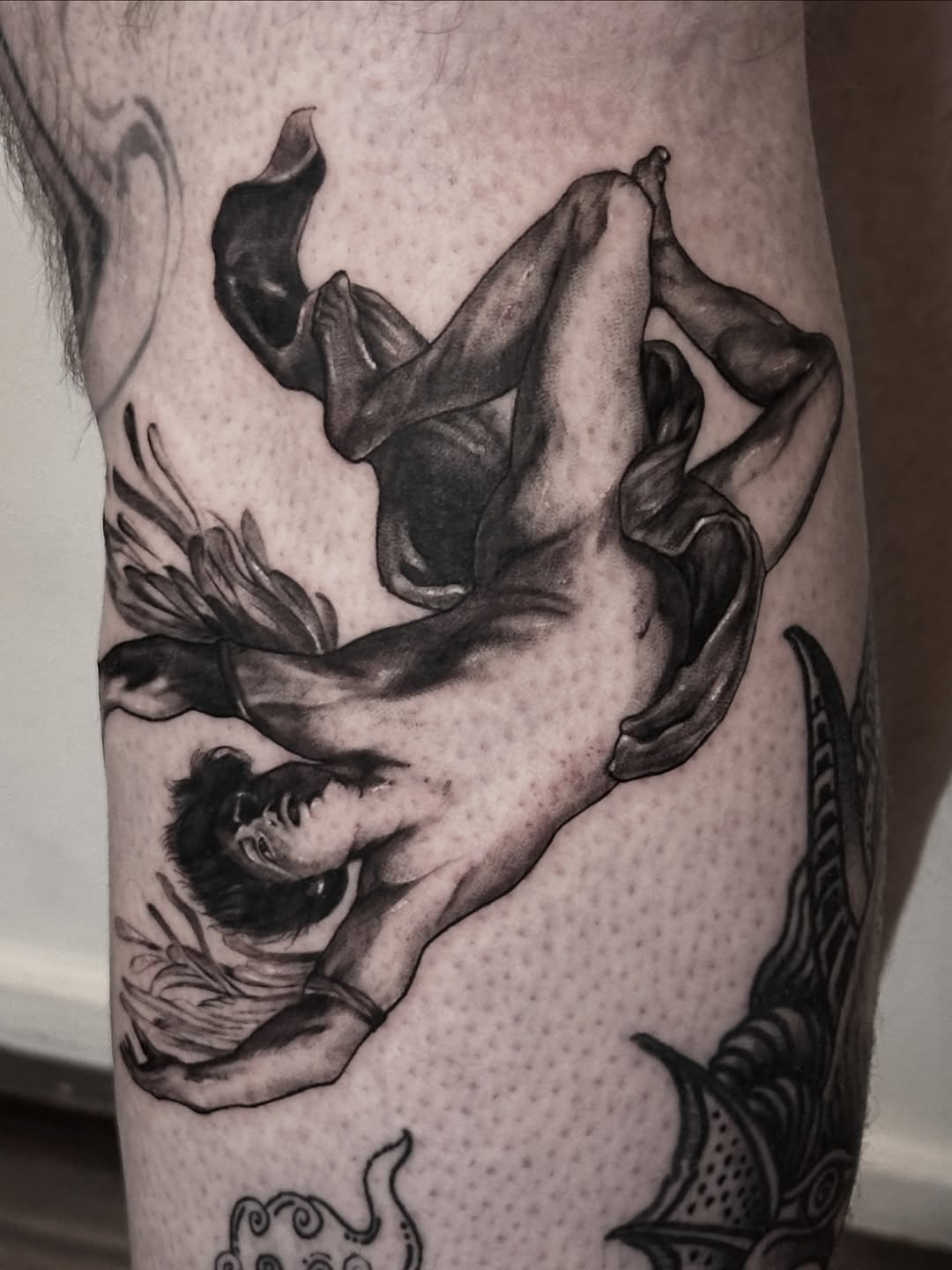 Dramatic Icarus silhouette descends with fluttering wings