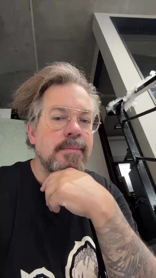 Bold black-and-gray forearm piece with ornamental shading