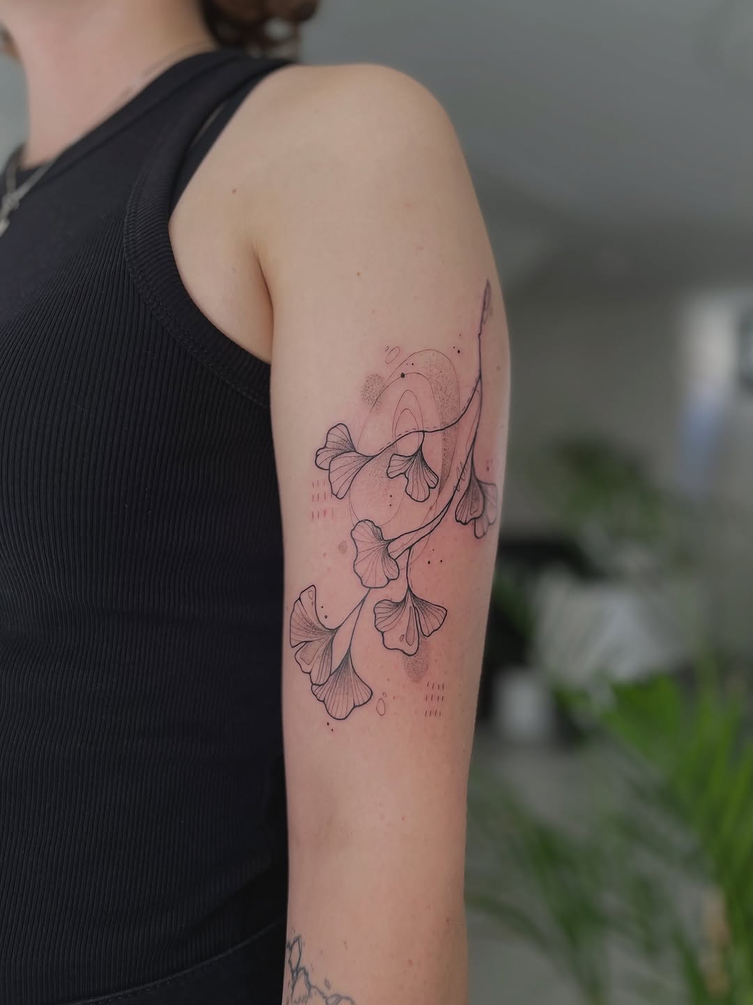 Delicate ginkgo leaves in fine-line, airy composition.