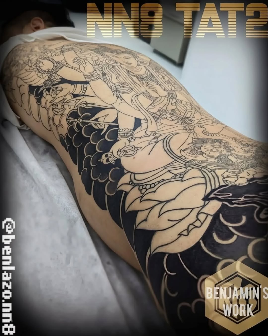 Eighteen-armed Bodhisattva in bold blackwork linework