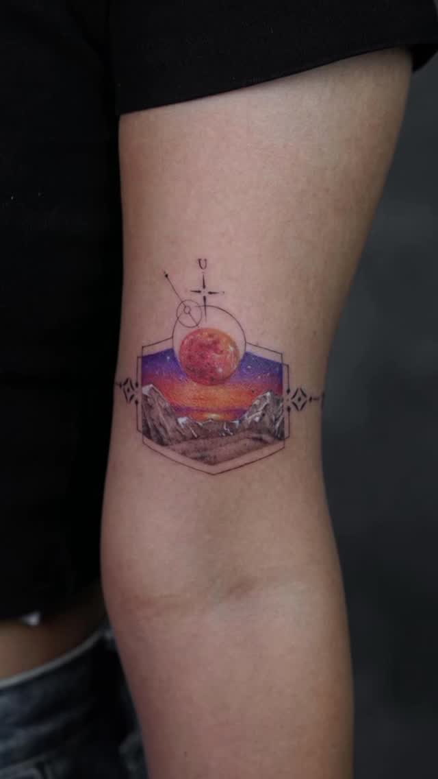 Geometric hex frame with mountain range and red moon