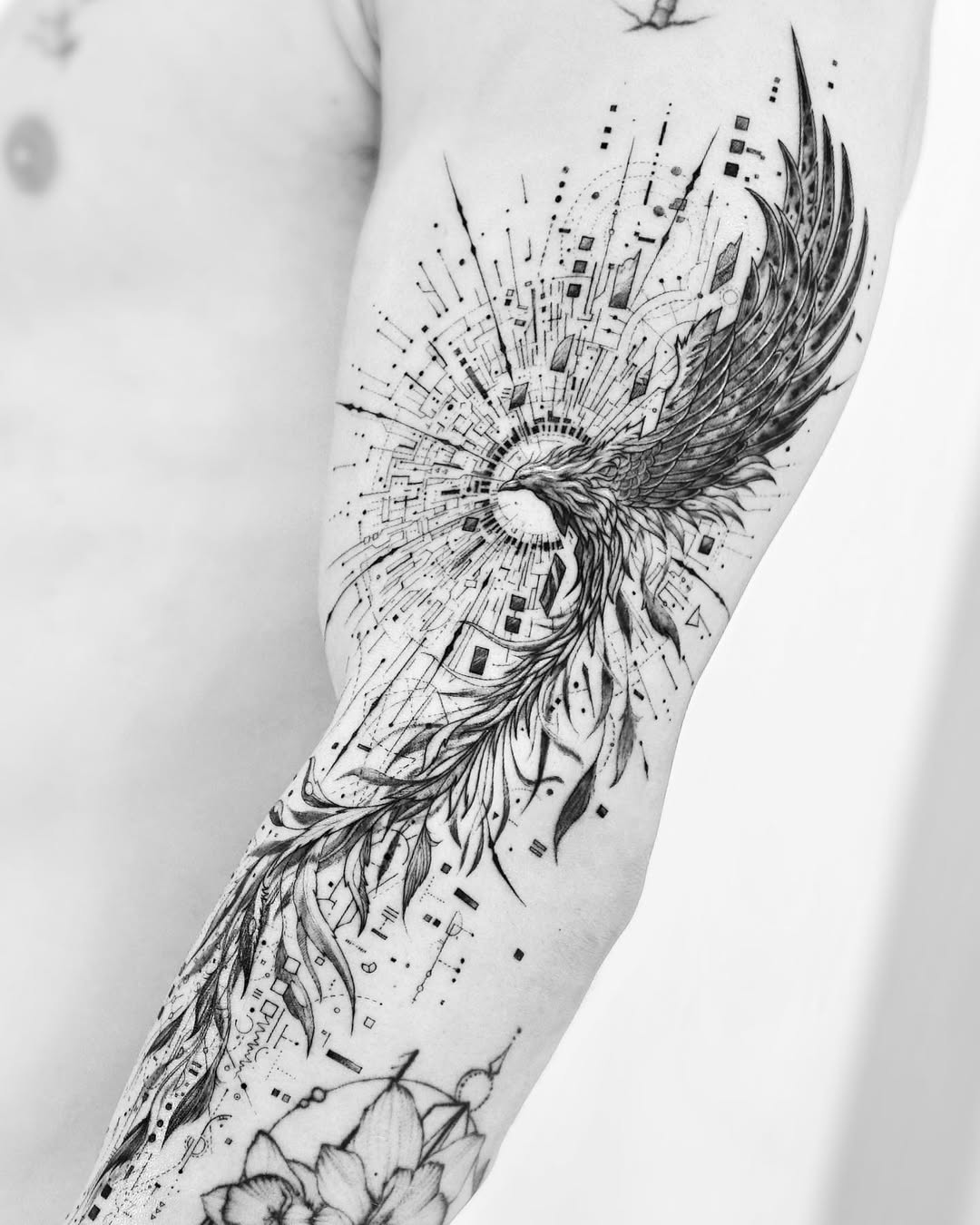 Intricate fineline phoenix with geometric sunburst motifs