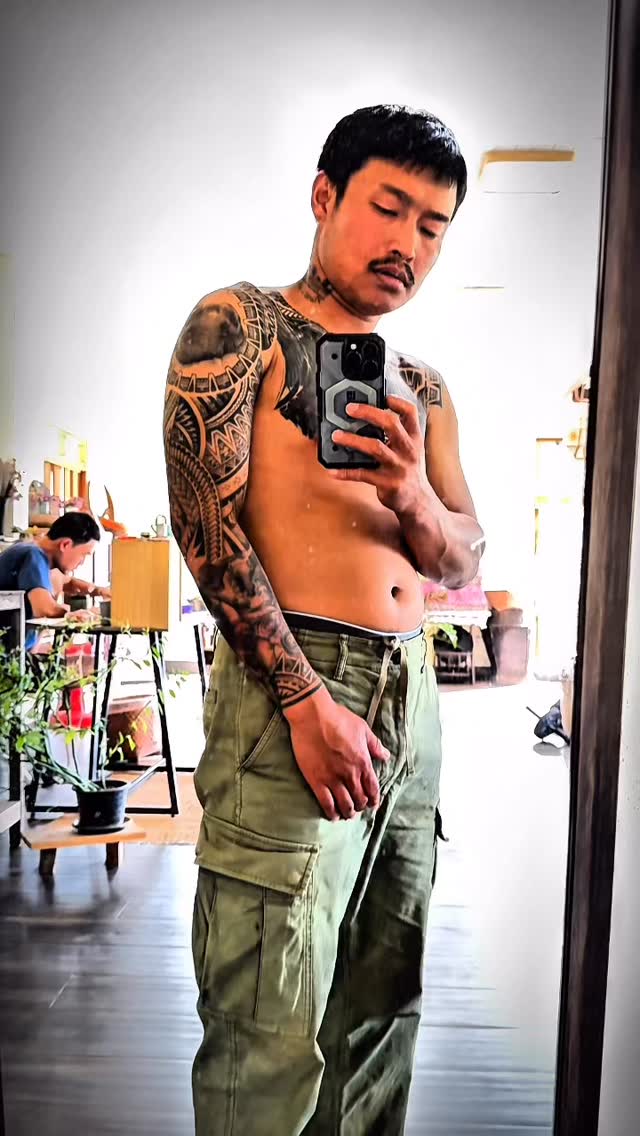 Intricate Polynesian blackwork tribal sleeve on left arm