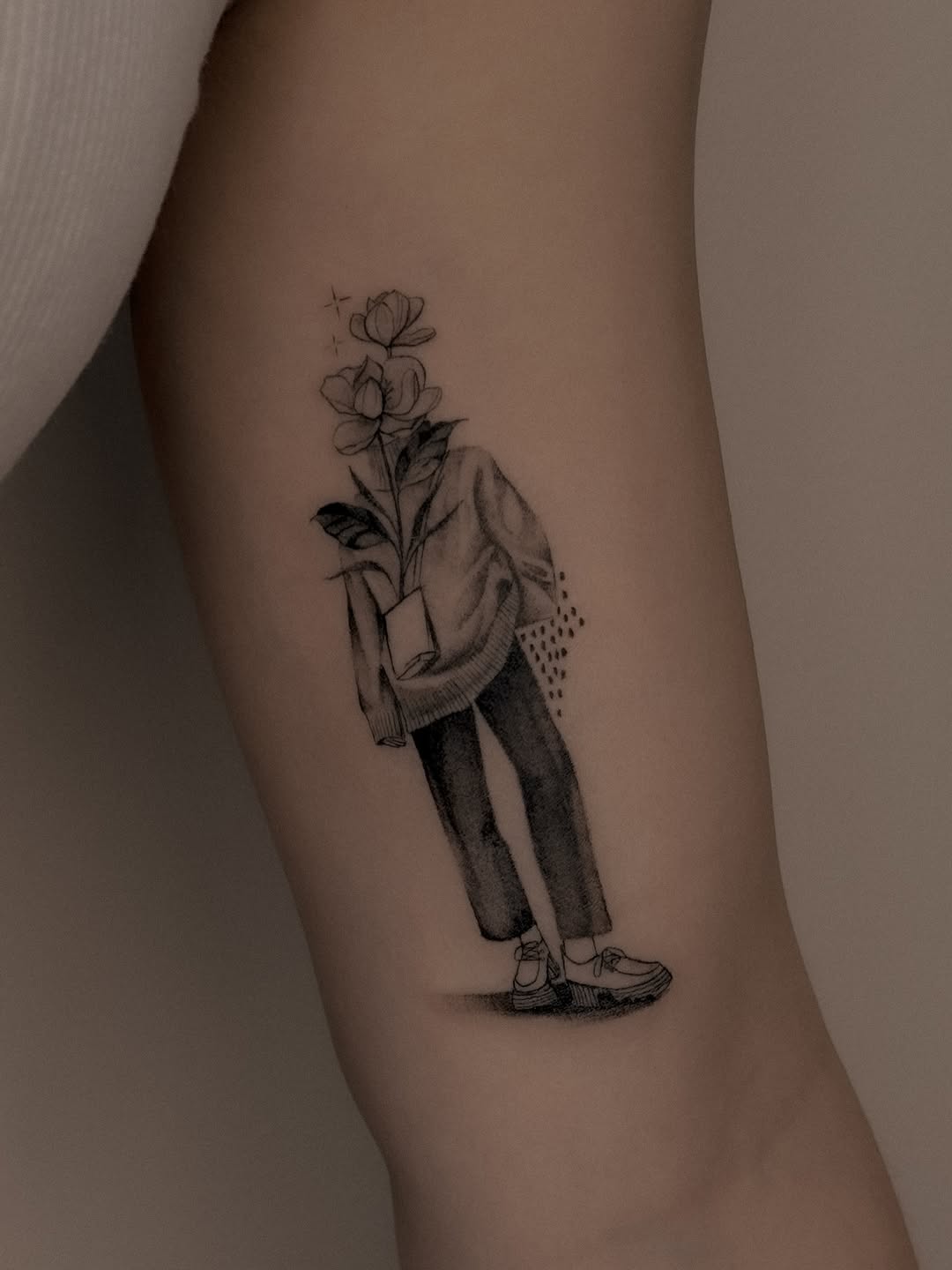 Stylized minimalist figure in a suit with a floral head