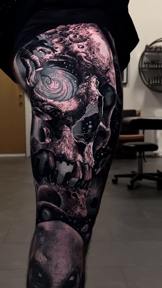 Cosmic-space skull in moody black-and-grey with galaxies