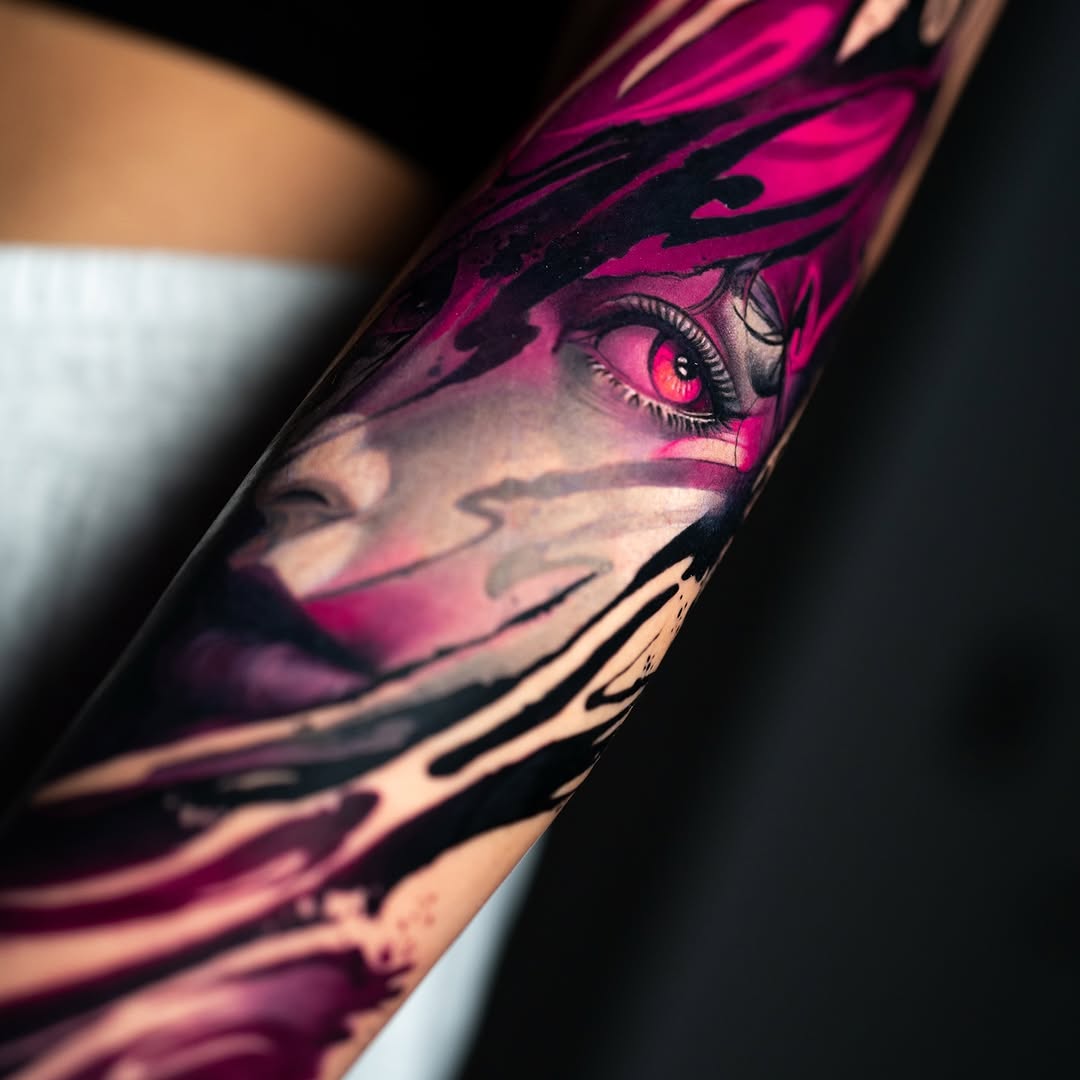 Vivid magenta-black abstract arm piece surrounding an eye motif