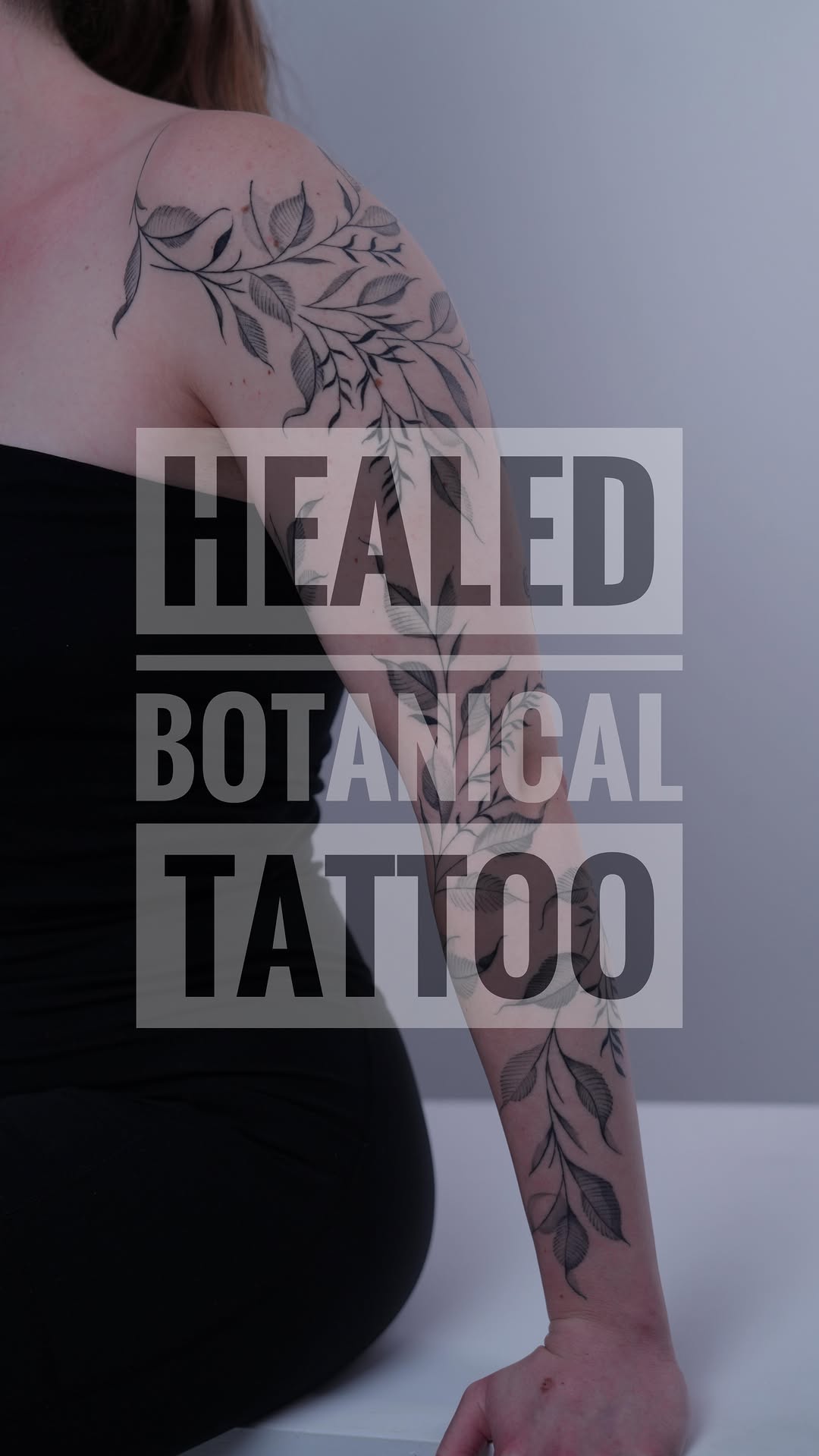 Delicate blackwork botanical vines along shoulder and arm