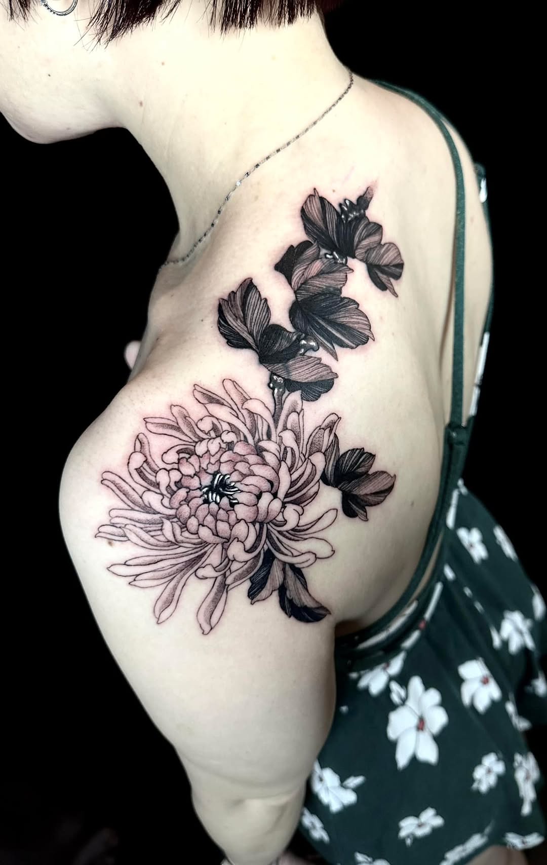 Bold black-and-gray chrysanthemum cover-up with delicate shading