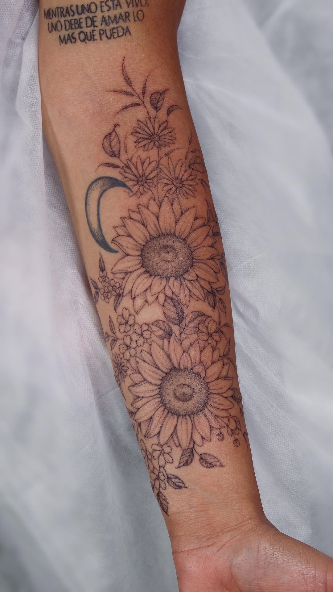 Intricate sunflower bouquet with a crescent moon accent.