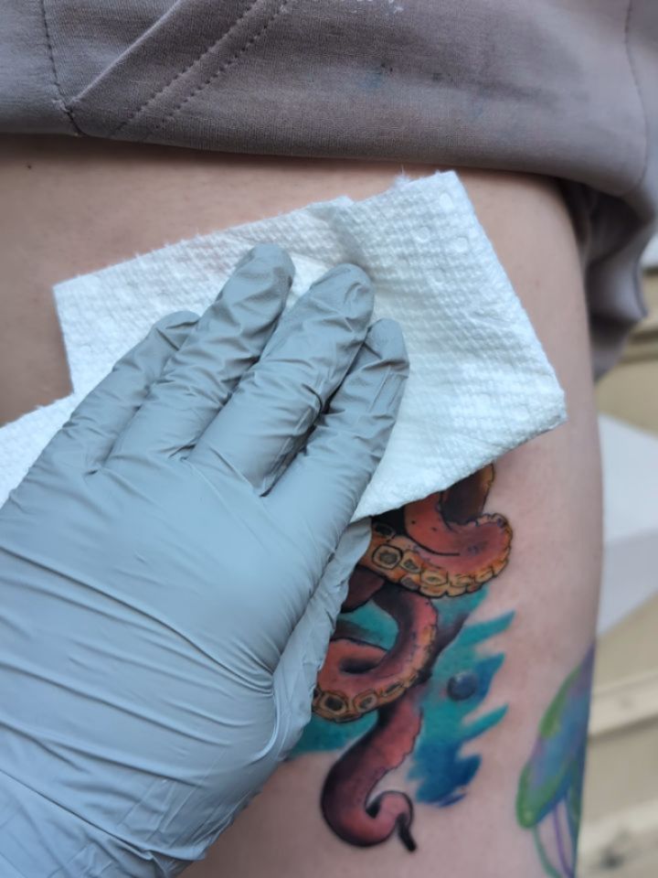 Vibrant watercolor seahorse with teal splash background