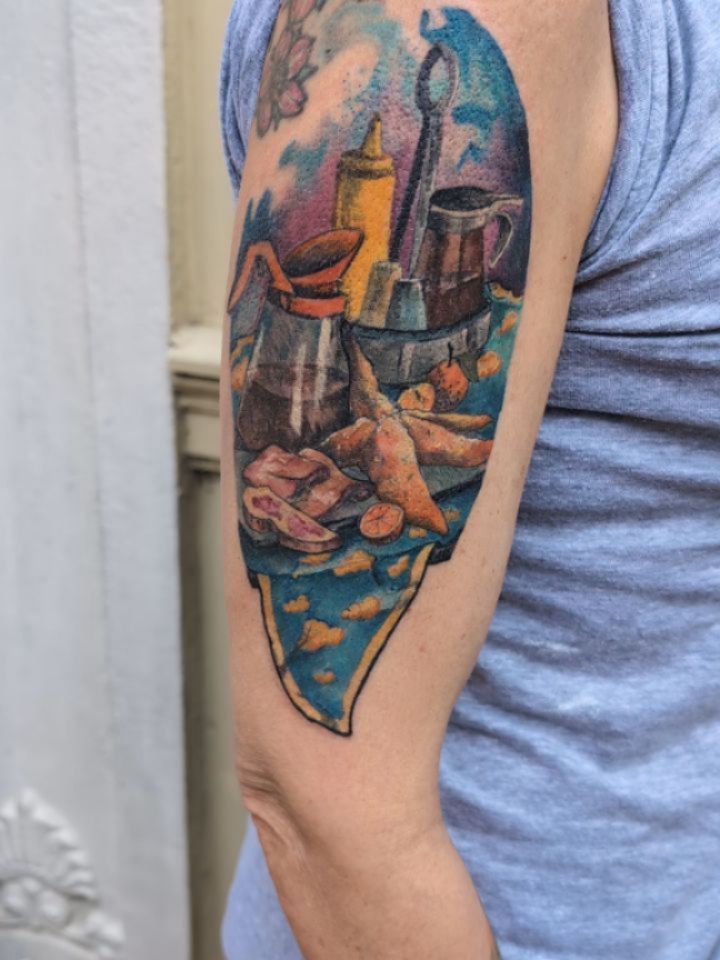 Bright illustrative still-life on forearm with watercolor accents