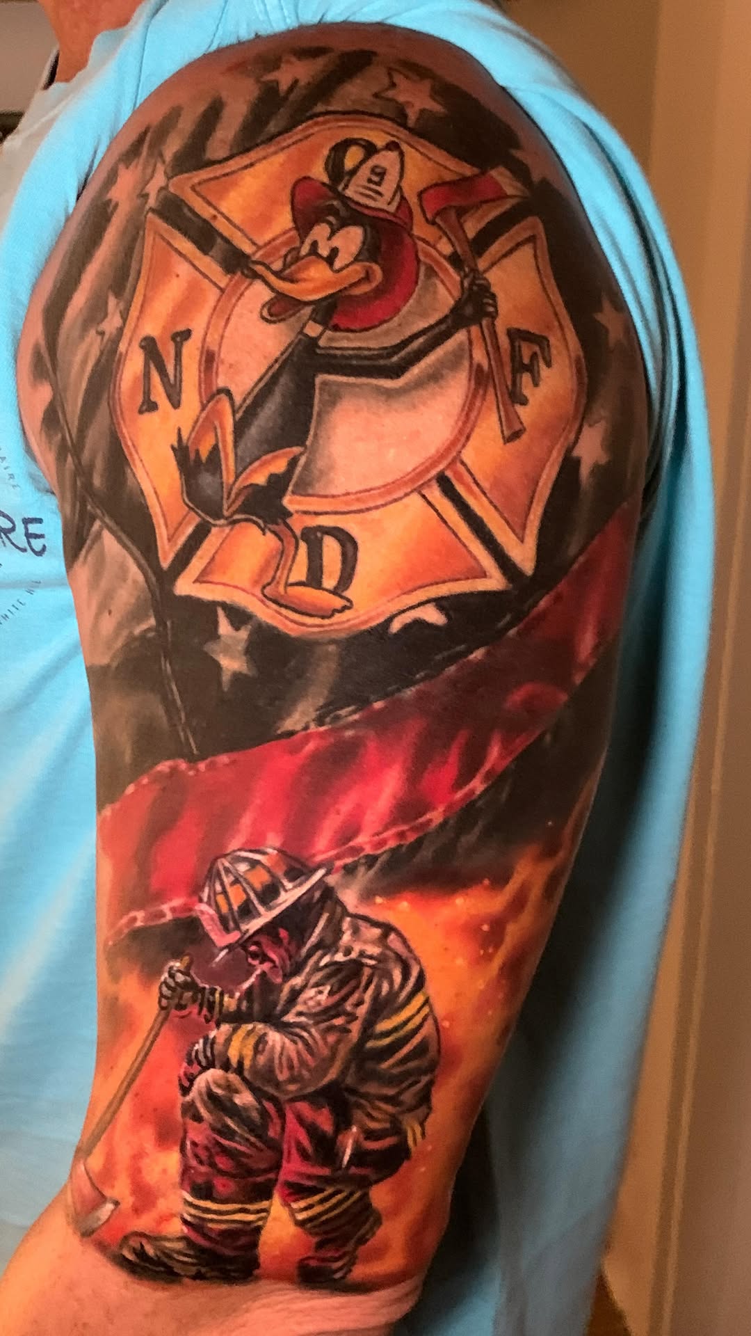 Bold firefighter sleeve segment with crest and kneeling rescuer.