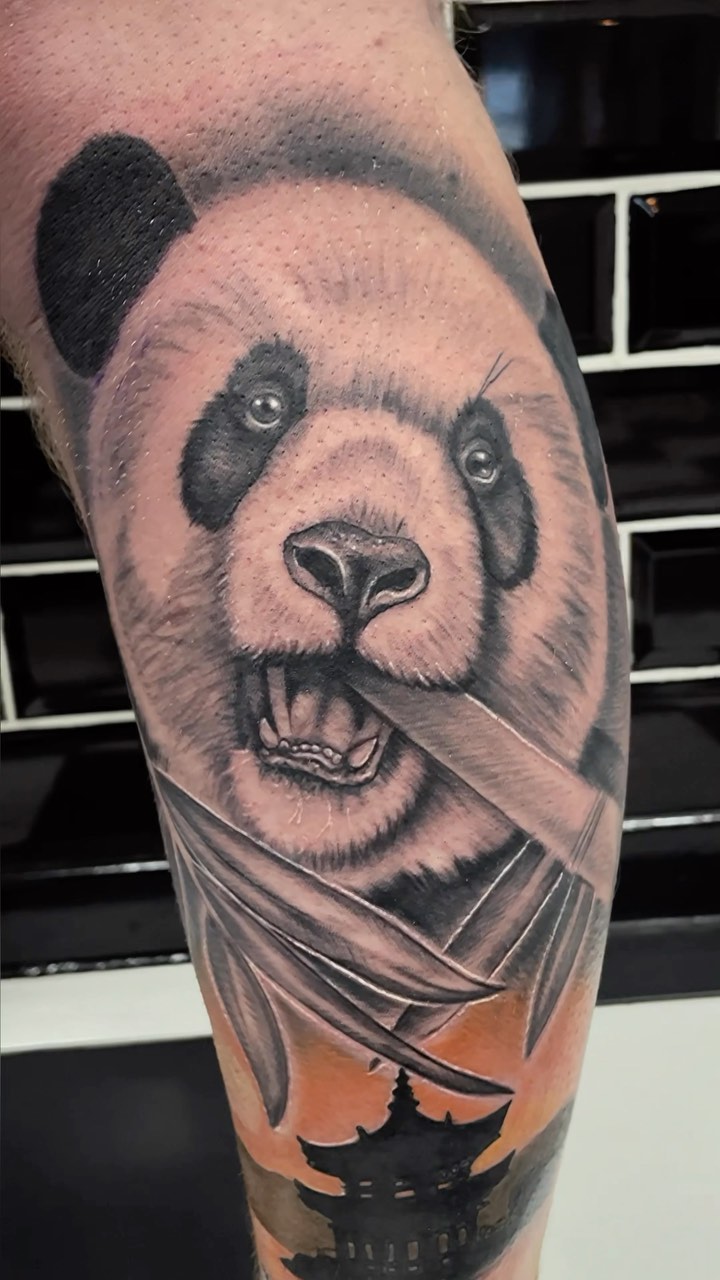 Whimsical panda head with bamboo leaves and sunset pagoda