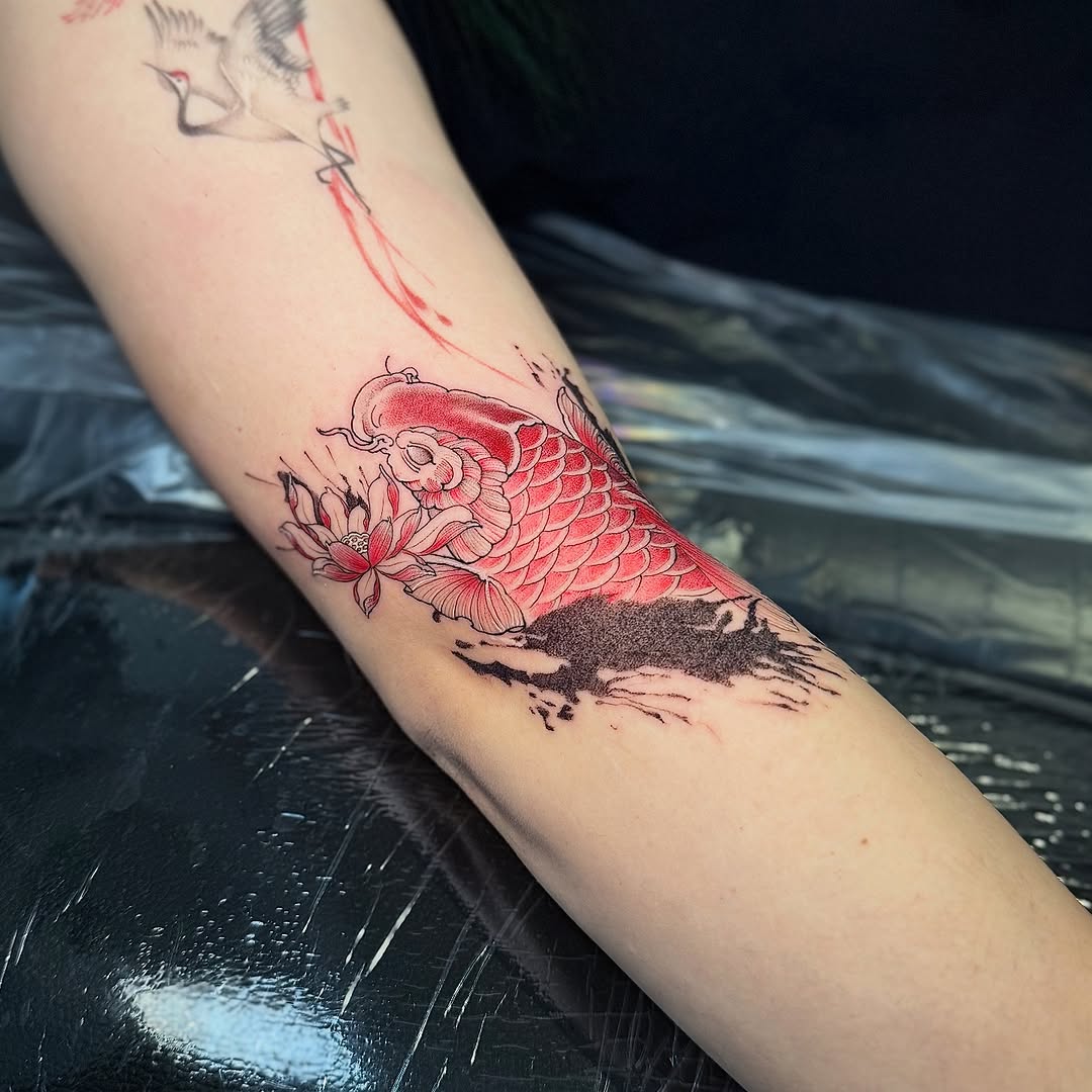 Koi fish with red scales, blooming flower, ink splash