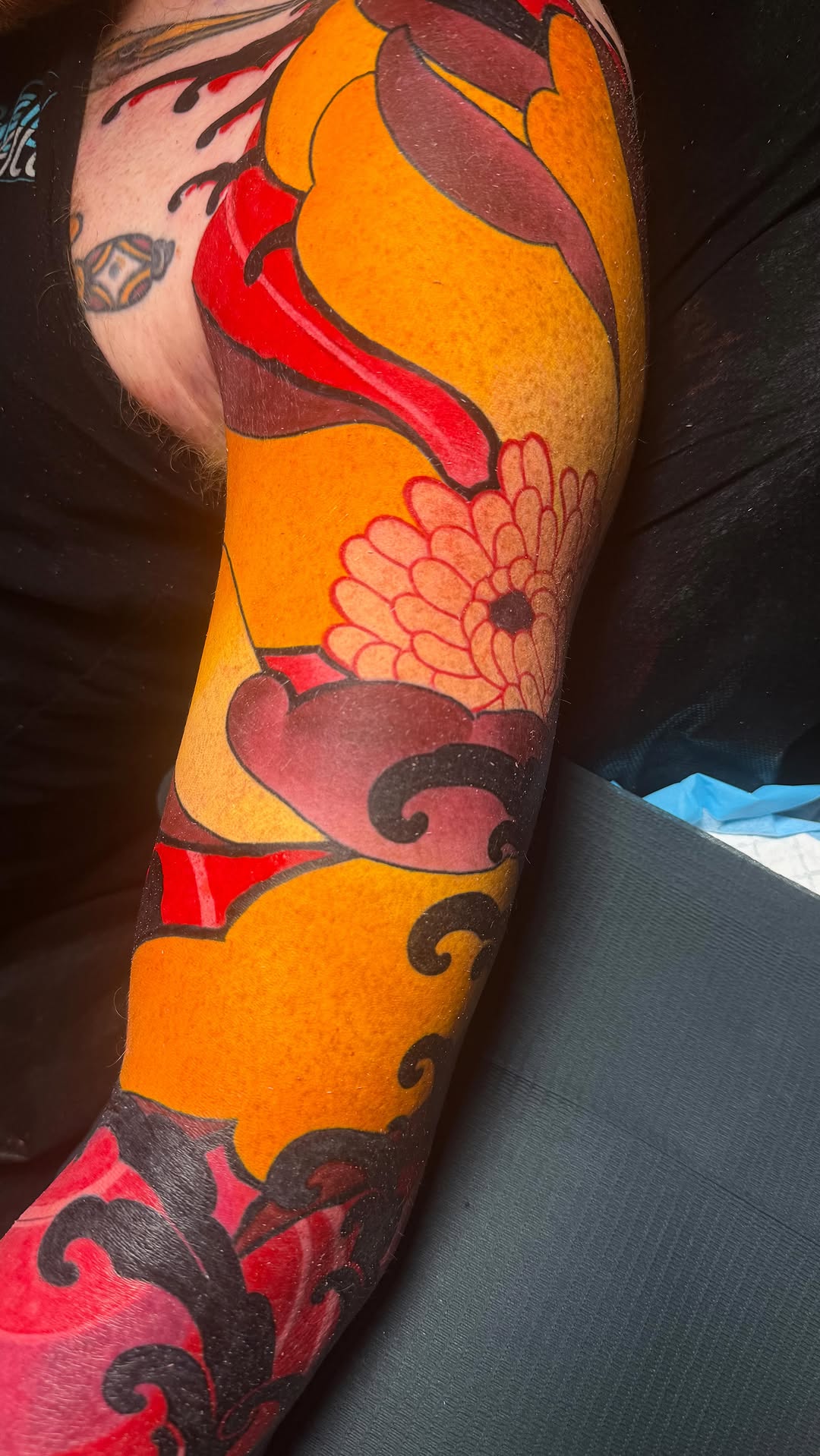 Vibrant neo-Japanese floral sleeve with bold outlines