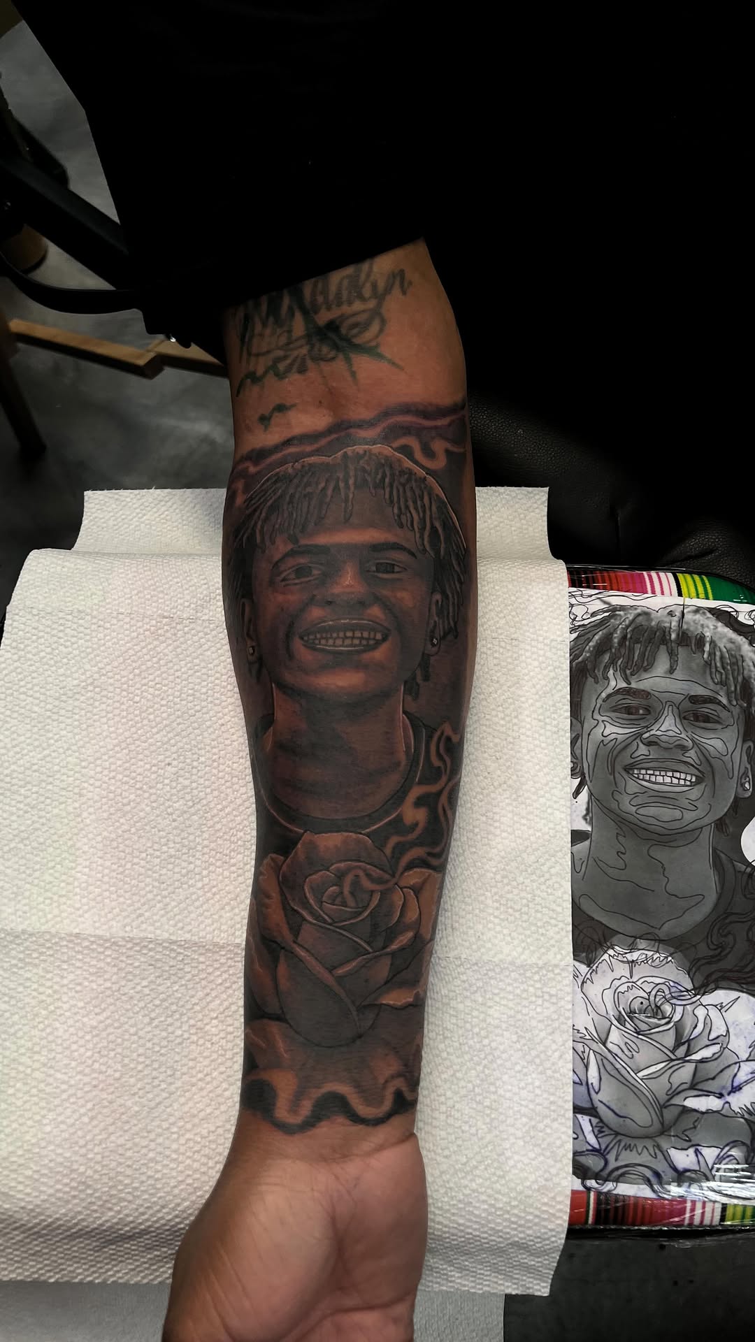 Hyper-detailed grayscale portrait with dreadlocks and a rose