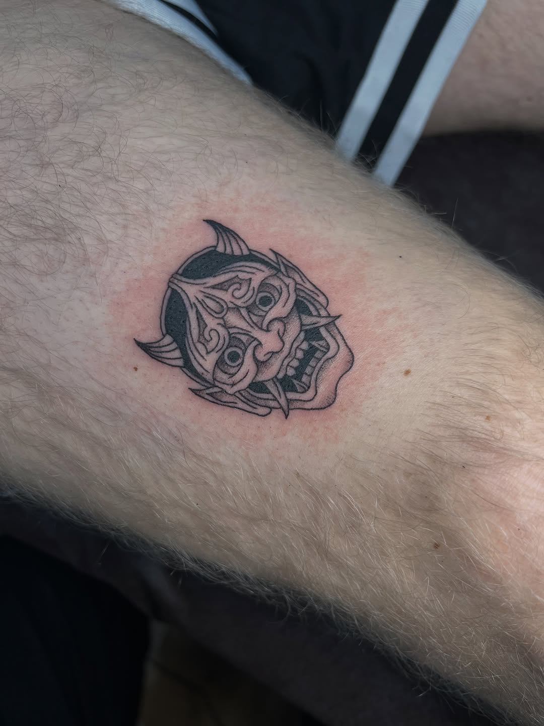 Detailed hannya mask with bold outlines and shading, monochrome