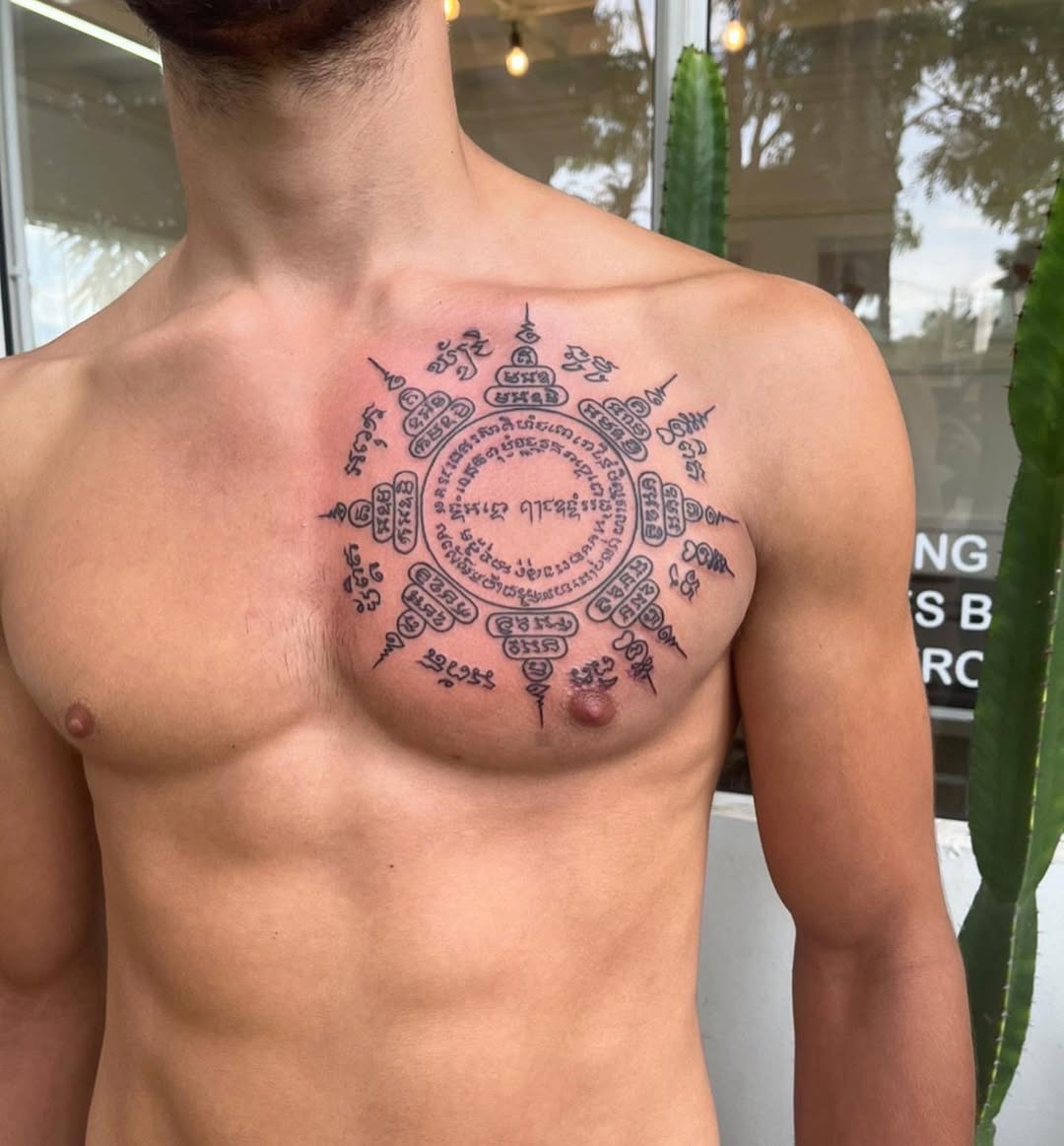 Intricate Sak Yant circular mandala with Khmer script