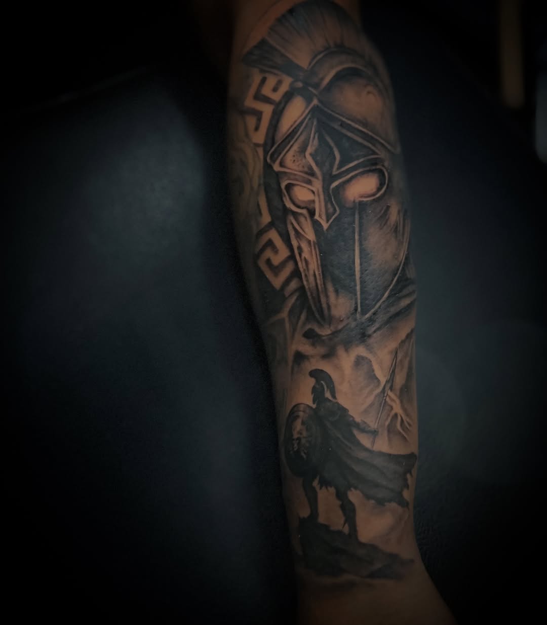 Dramatic black-and-gray Spartan helmet with warrior silhouette