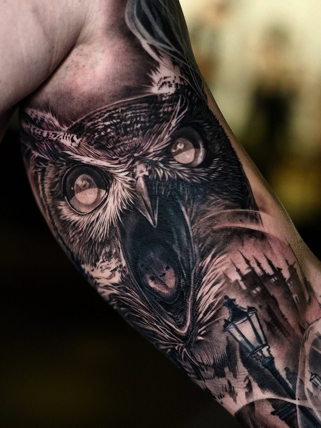 Hyper-detailed black-and-gray owl sleeve with moody realism