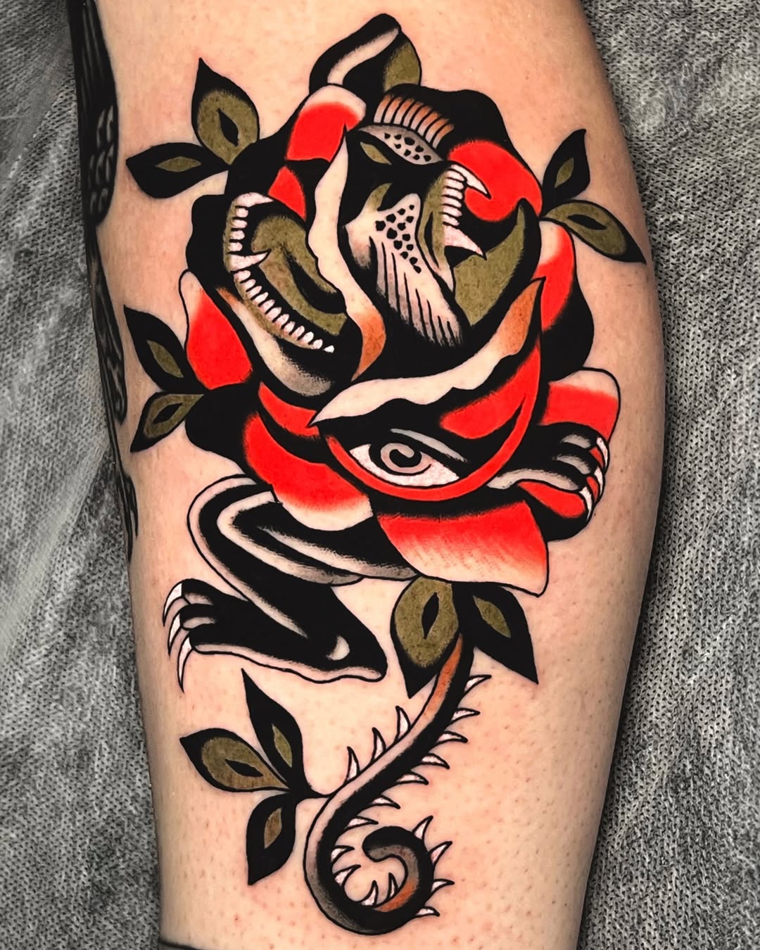 Bold neo-traditional rose with coiled snake motif