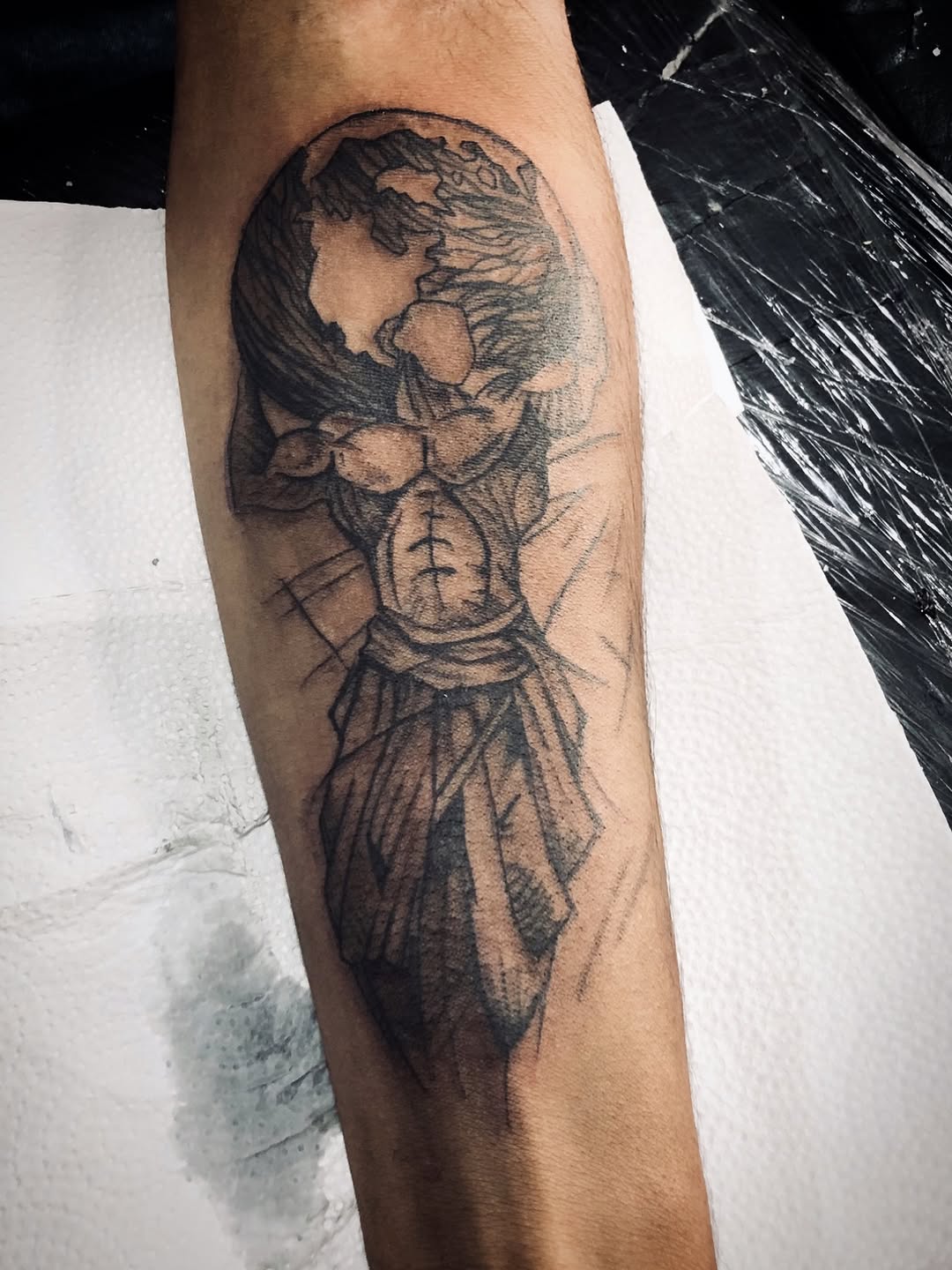 Monumental hooded figure rendered in bold geometric lines