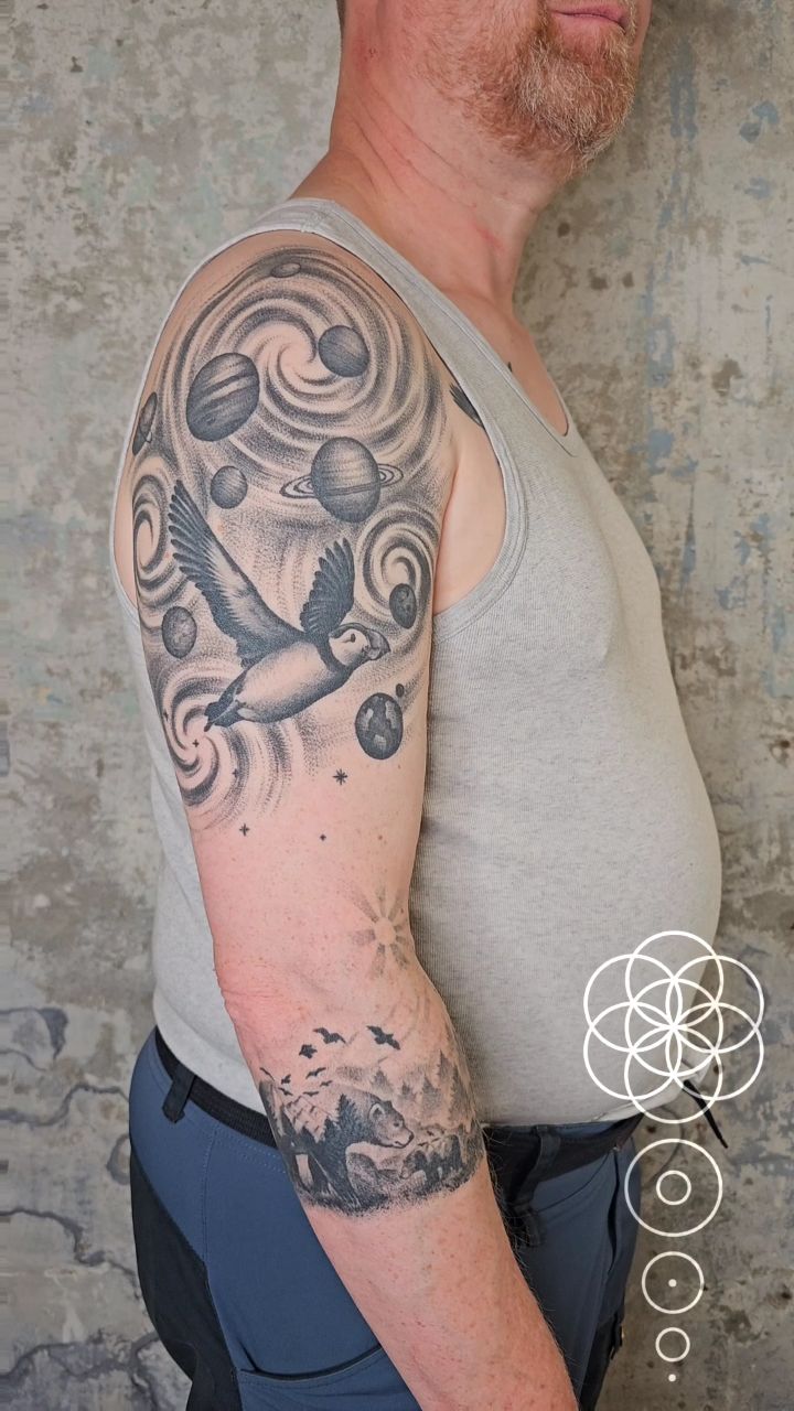 Cosmic puffin with spiraling planets over a forest scene