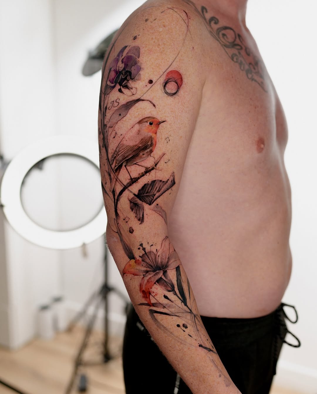 Watercolor floral sleeve with a perched robin and blossoms