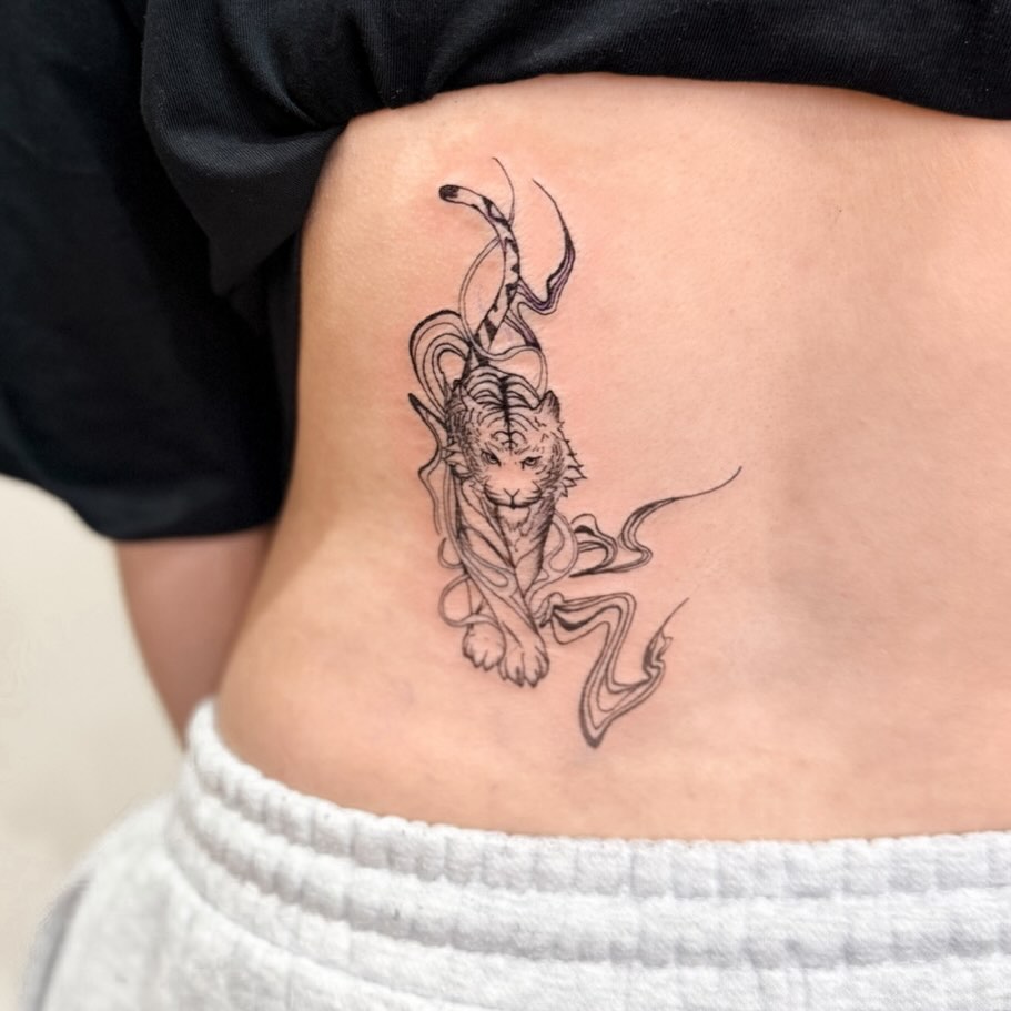 Delicate fineline tiger with swirling ribbon lines