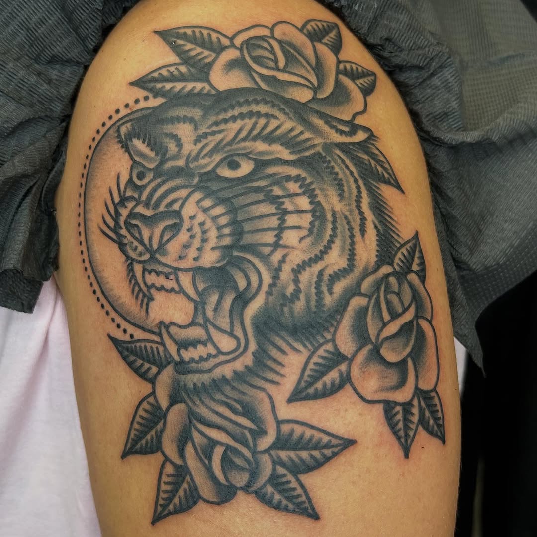 Ferocious tiger head with bold black shading and roses